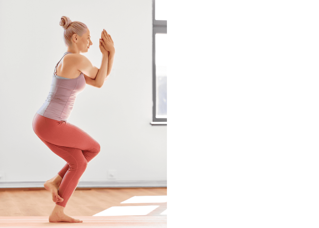 Female practicing yoga in eagle pose.