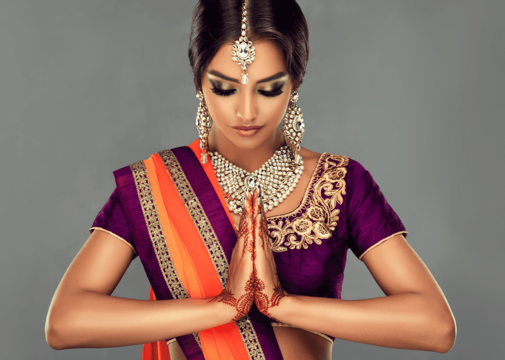 Indian woman with her hands in añjali mudrā.