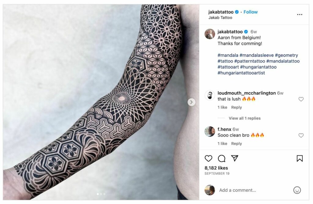 Mandala symbol arm sleeve tattoo.