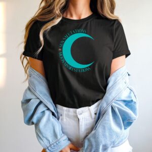 Female yogi with long hair wearing a casual black yoga graphic print t-shirt that says Sun Salutations Moon Manifestations.
