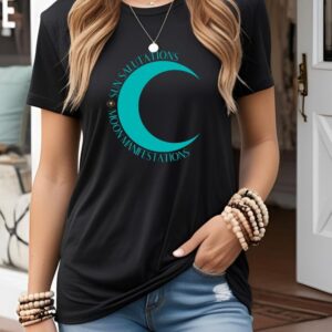 Female yogi with long hair wearing a casual black yoga graphic print t-shirt that says Sun Salutations Moon Manifestations.