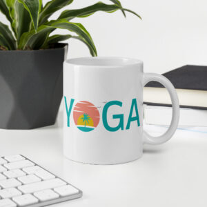 White ceramic yoga coffee cup with a graphic print design that says yoga and has a sunset design printed on both sides of the mug.