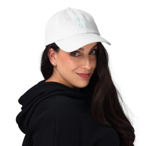 Woman with long black hair wearing a white yoga trucker with a clean minimalist yoga logo in teal font on the front.