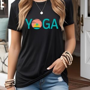 Female yogi with long hair wearing a casual black yoga graphic print t-shirt with a yoga sunset design.