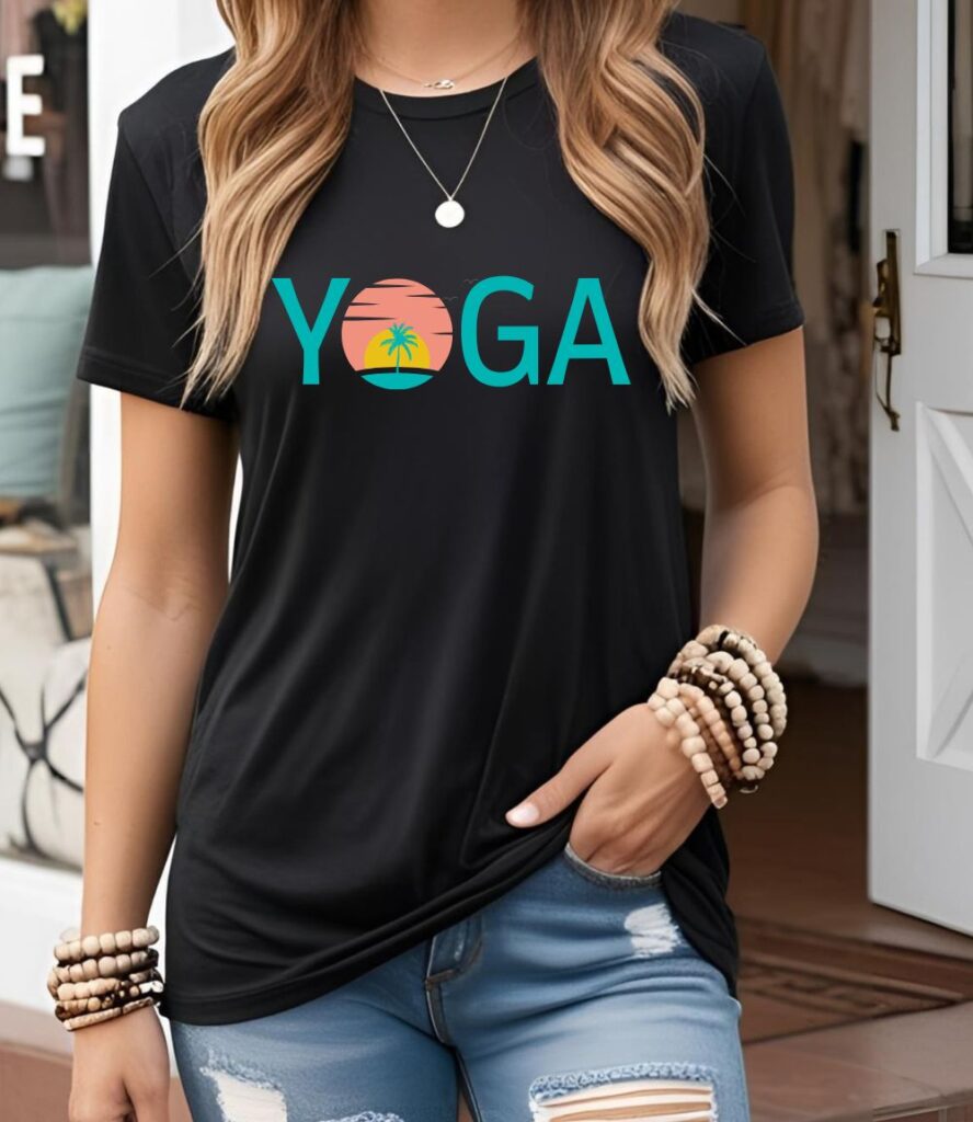Female yogi with long hair wearing a casual black yoga graphic print t-shirt with a yoga sunset design.